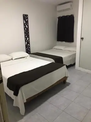Cama o camas de una habitación en Hotel Puerto Bello Veracruz