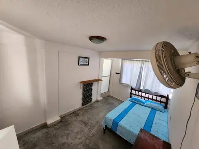 Cama o camas de una habitación en Habitaciones Nava