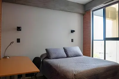 Cama o camas de una habitación en TORRE ARCARTI Internet alta velocidad y estacionamiento