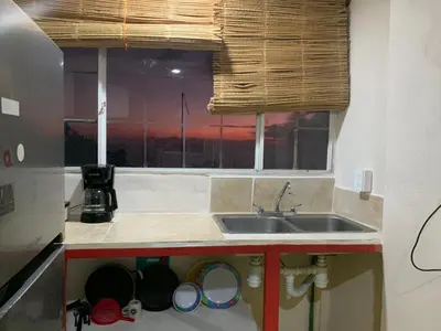 Una cocina o zona de cocina en Habitaciones Nava