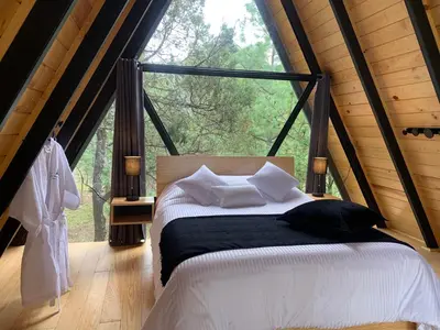 Cama o camas de una habitación en La Morada Luxury Cabin