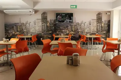 Una televisión o centro de entretenimiento en Hotel Urbainn