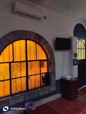 Una televisión o centro de entretenimiento en Hotel San Jose Purua