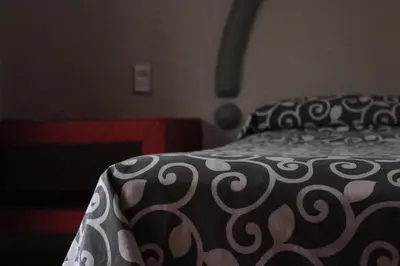 Cama o camas de una habitación en Hotel Real Ocotepec