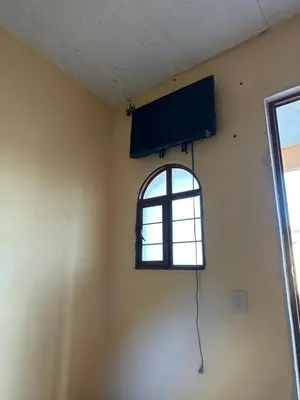 Una televisión o centro de entretenimiento en Hotel Casa Eduardo Martinez