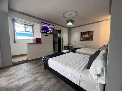 Cama o camas de una habitación en Hotel Gandag