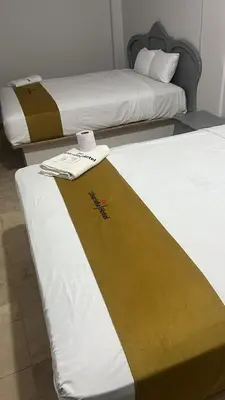 Cama o camas de una habitación en Hotel Sharidia Inn