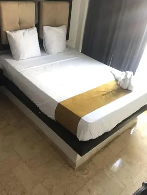 Cama o camas de una habitación en Hotel Sharidia Inn