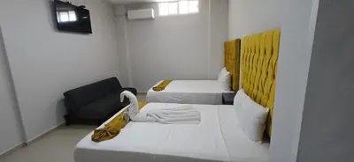 Cama o camas de una habitación en Hotel Sharidia Inn