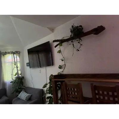 Una televisión o centro de entretenimiento en Casa Rústica los Arcos