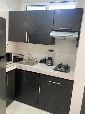 Una cocina o zona de cocina en Suite completa con servicio de chófer