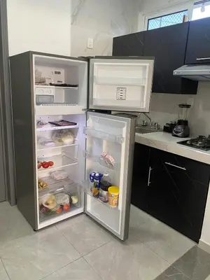 Una cocina o zona de cocina en Suite completa con servicio de chófer