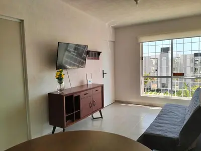 Una televisión o centro de entretenimiento en Departamento de descanso