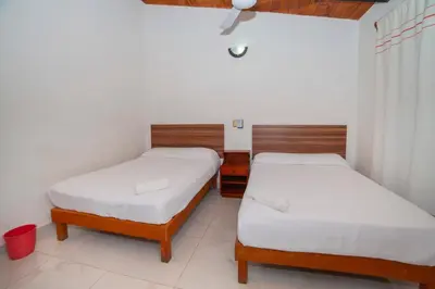 Cama o camas de una habitación en Hotel Del Profe, Huatulco