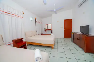 Cama o camas de una habitación en Hotel Del Profe, Huatulco