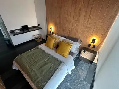 Cama o camas de una habitación en Apartment with balcony in the heart of the city