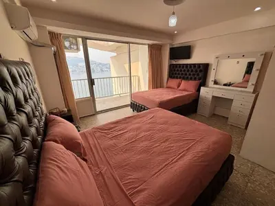 Cama o camas de una habitación en PH vista a la bahía