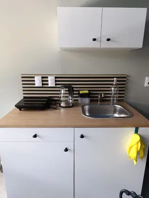 Una cocina o zona de cocina en El Árbol Plaza Suites - Agua