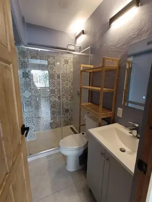 Un baño de El Árbol Plaza Suites - Agua