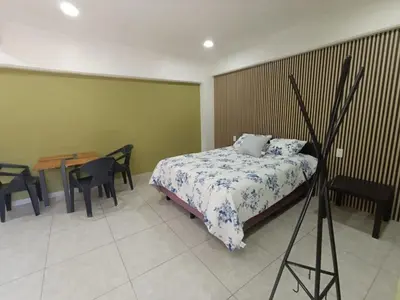 Cama o camas de una habitación en El Árbol Plaza Suites - Terra