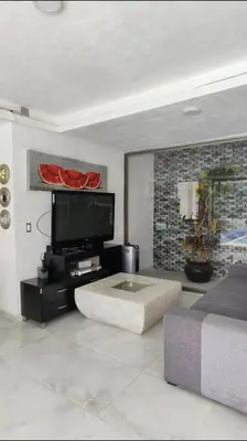 Una televisión o centro de entretenimiento en Wind view, Hill View Villa in Cuernavaca 8px