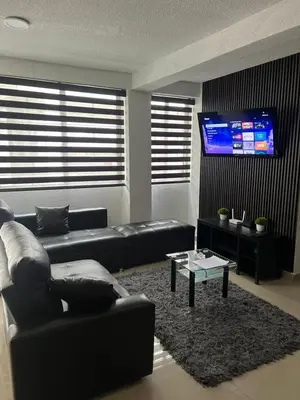 Una televisión o centro de entretenimiento en Departamento Diamante