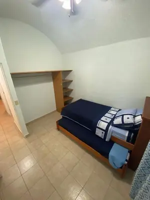 Cama o camas de una habitación en Casa Paz, amplia y cómoda frente a la alberca