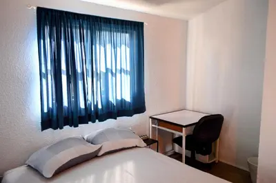 Cama o camas de una habitación en Acogedora Casa con Jardín en Centro de Cd Sahagún
