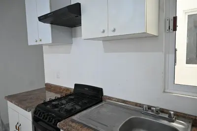 Una cocina o zona de cocina en Departamentos La Soledad
