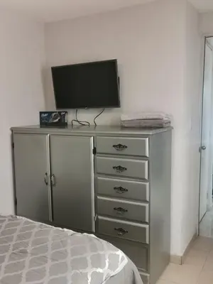 Una televisión o centro de entretenimiento en Balnearios, Casa villas la palma