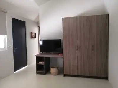 Una televisión o centro de entretenimiento en Residencial San Agustin Loft