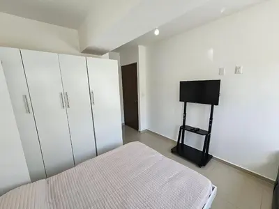 Cama o camas de una habitación en Habitación con baño privado en departamento compartido cerca de zona de conciertos