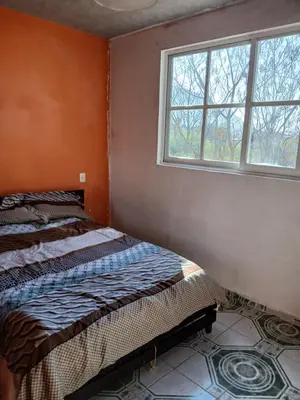 Cama o camas de una habitación en Tranquila casa
