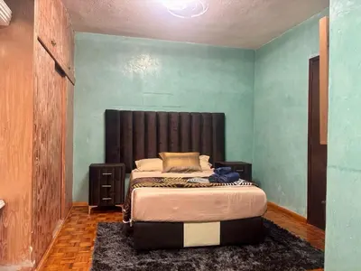 Cama o camas de una habitación en Habitación Esmeralda