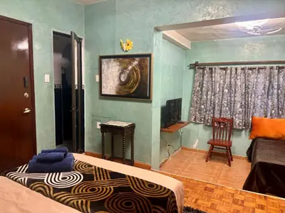 Una televisión o centro de entretenimiento en Habitación Esmeralda
