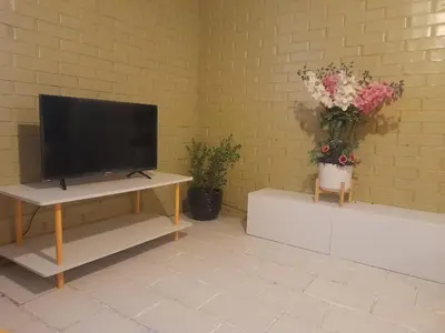Una televisión o centro de entretenimiento en Departamento Mamá Rosita