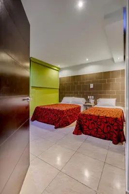 Cama o camas de una habitación en First Inn Hotel & Business