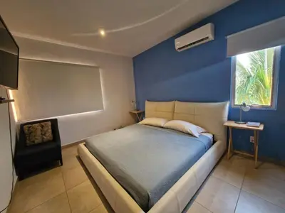 Cama o camas de una habitación en Casa Mar y Laguna PUERTA AL SOL