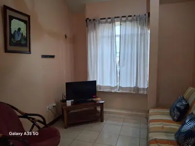 Una televisión o centro de entretenimiento en Sicarú Suites