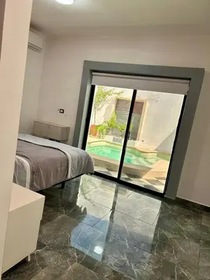 Cama o camas de una habitación en La casa de los abuelos
