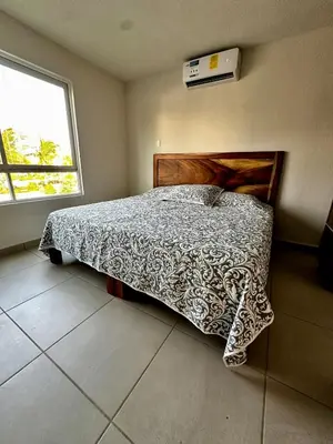 Cama o camas de una habitación en Departamento Acapulco Diamante