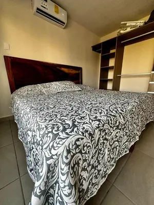 Cama o camas de una habitación en Departamento Acapulco Diamante