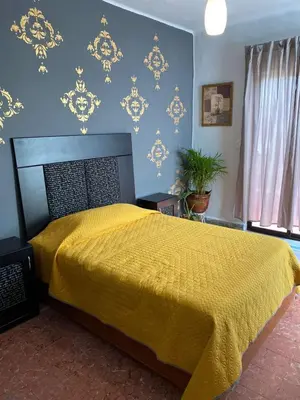 Cama o camas de una habitación en Casa cerca del centro histórico María Luisa