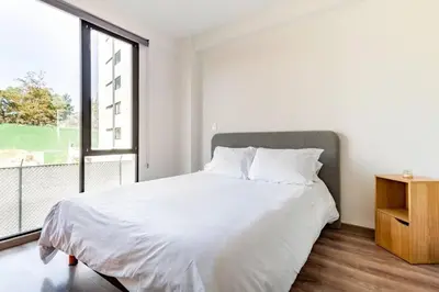 Cama o camas de una habitación en Moderno Loft Totalmente Equipado