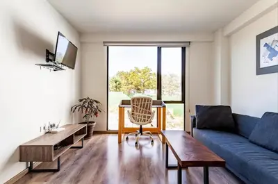 Zona de estar de Moderno Loft Totalmente Equipado