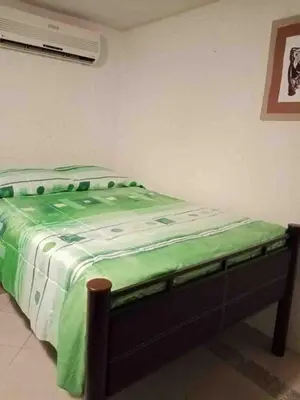 Cama o camas de una habitación en Alojamiento en Punta Diamante Acapulco