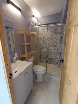 Un baño de El Árbol Plaza - Suites Aire