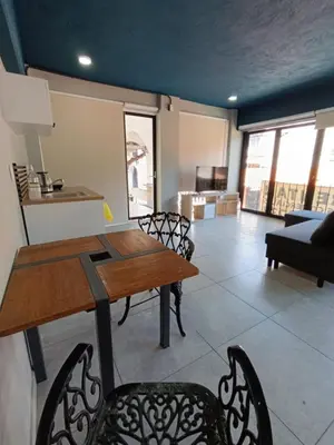 Zona de estar de El Árbol Plaza - Suites Aire