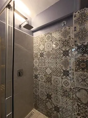 Un baño de El Árbol Plaza - Suites Aire