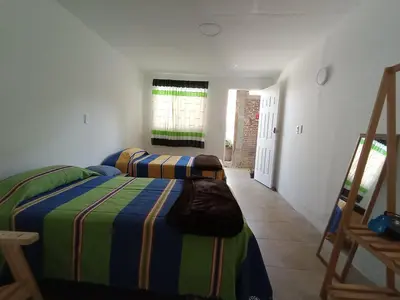 Cama o camas de una habitación en Iguana Coliving